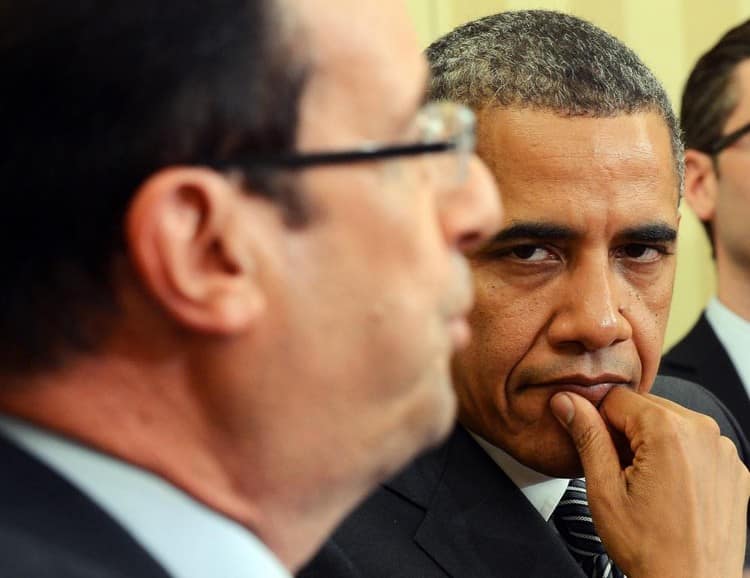 US President Barack Obama (R) listens as French President Francois Hollande speaks following their bilateral meeting in the Oval Office at the White House in Washington, DC, on May 18, 2012 in advance of the G8 and NATO Summits. Obama told French counterpart Francois Hollande during White House talks on Friday that their countries' bilateral relationship is "deeply valued" by Americans. Just three days after being sworn in to replace pro-American president Nicolas Sarkozy, Hollande, a Socialist, held Oval Office talks with Obama focusing on the euro crisis and how to improve growth. AFP PHOTO/Jewel Samad